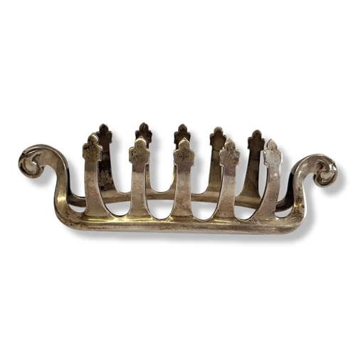 23 - AN EARLY 20TH CENTURY SILVER 'VIKING SHIP' TOASTRACK
Having scrolled ends and cruciform dividers, ha... 