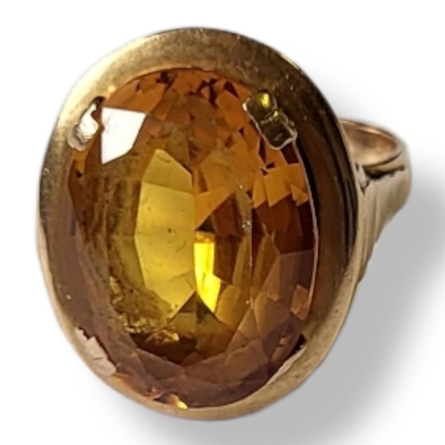 24a - A VINTAGE FRENCH 18CT GOLD AND CITRINE RING
The oval citrine in a wide gold mount eagle.
(size M/N)
... 