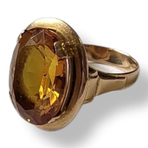 24a - A VINTAGE FRENCH 18CT GOLD AND CITRINE RING
The oval citrine in a wide gold mount eagle.
(size M/N)
... 