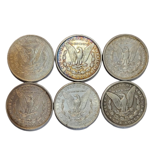 32a - A COLLECTION OF SIX AMERICAN SILVER MORGAN DOLLARS, DATED 1889, 1883, 1890, 1879, 1878 AND 1881 
Wit... 