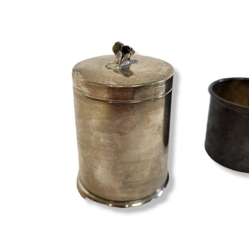 43 - A VINTAGE AMERICAN STERLING SILVER CYLINDRICAL BOX AND COVER
With floral finial, together with a Chr... 