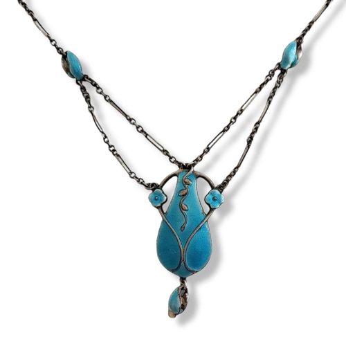 6 - AN ART NOUVEAU SILVER AND ENAMEL PENDANT NECKLACE
The pale blue enamel panel with enamel decorated n... 