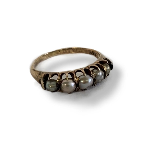 7a - A LATE 19TH/ EARLY 20TH CENTURY 15CT GOLD AND PEARL RING 
Having five graduated pearls.
(size L/M)

... 