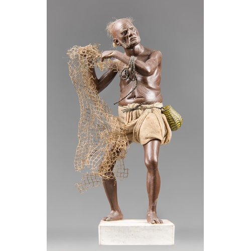 166 - A FINE 19TH CENTURY CLAY INDIAN FIGURE OF A FISHERMAN.
Made in Krishnanagar, West Bengal. Sculpted w... 