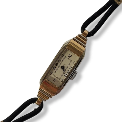 185 - WITHDRAWN AN ART DECO 18CT BICOLOUR GOLD LADIES’ COCKTAIL WATCH
Having a rectangular stepped case on... 