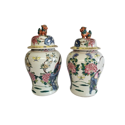 369A - A PAIR OF CHINESE VASES VASES AND COVERS
With kylin finials and enamelled decoration in the form of ... 