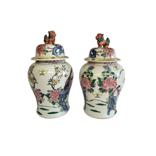 369A - A PAIR OF CHINESE VASES VASES AND COVERS
With kylin finials and enamelled decoration in the form of ... 