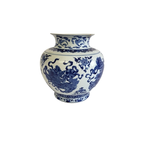 359 - A CHINESE BLUE AND WHITE VASE
The flared neck on a bulbous body, decorated with dragons and foliage,... 