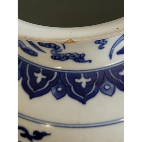 359 - A CHINESE BLUE AND WHITE VASE
The flared neck on a bulbous body, decorated with dragons and foliage,... 