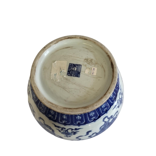 359 - A CHINESE BLUE AND WHITE VASE
The flared neck on a bulbous body, decorated with dragons and foliage,... 