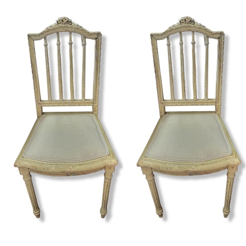 535 - A PAIR OF LATE 19TH CENTURY FRENCH SALON CHAIRS
In a distressed cream painted finish and upholstered... 