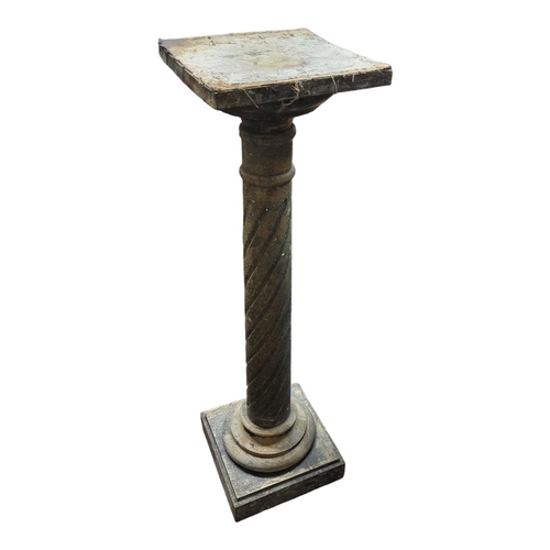 555 - A REGENCY STYLE MAHOGANY TORCHERE
With circular top on reed column on three splayed acanthus carved ... 