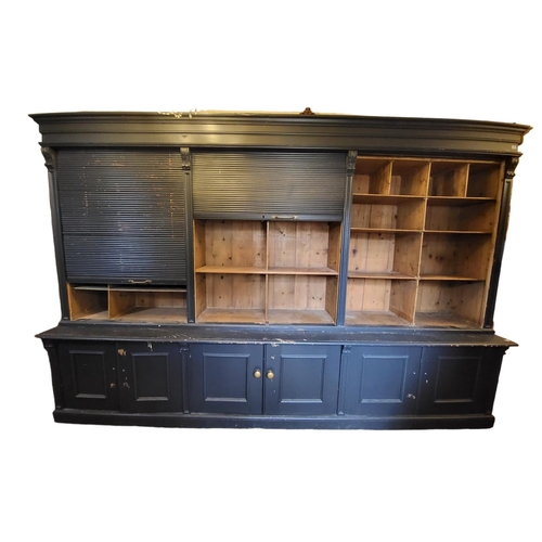 557 - A VERY LARGE AND IMPRESSIVE VICTORIAN DESIGN PAINTED PINE SHOP'S CABINET
With stepped cornice above ... 