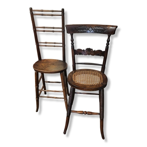 562 - TWO 19TH CENTURY BAR BACK CHILD CORRECTIONAL CHAIRS
One with carved back and cane seat, the other wi... 