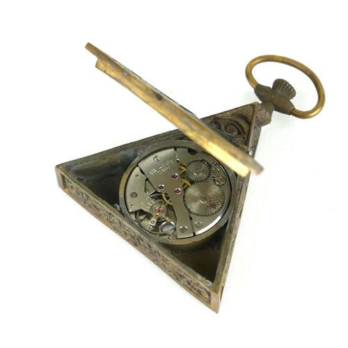 183 - A NOVELTY BRASS MASONIC POCKET WATCH
Triangular form with bossed symbols to case and mechanical move... 