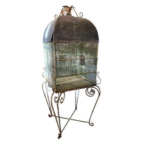 567 - A LARGE 19TH CENTURY PAINTED IRON AND ZINC DOMED TOPPED BIRDCAGE ON WROUGHT IRON SCROLL WORK STAND.
... 