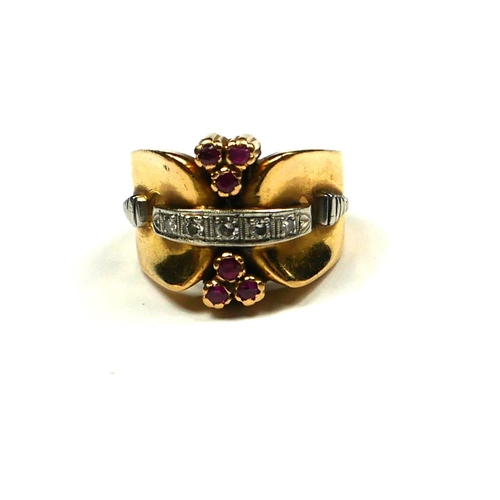 225 - A VINTAGE 14CT GOLD, RUBY AND DIAMOND COCKTAIL RING
The single row of round cut diamonds with two cl... 