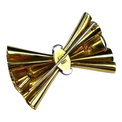 226 - A VINTAGE 18CT GOLD AND DIAMOND BOW BROOCH
The row of round cut diamonds in a geometric form.
(appro... 