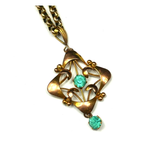 262 - AN ART NOUVEAU 9CT GOLD AND AQUAMARINE PENDANT NECKLACE
The central round cut stone in a pierced and... 