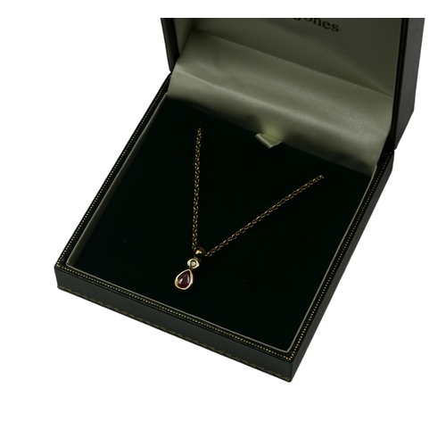 286 - A 9CT GOLD, RUBY AND DIAMOND PENDANT NECKLACE
Having a pear cut ruby set with a round cut diamond on... 