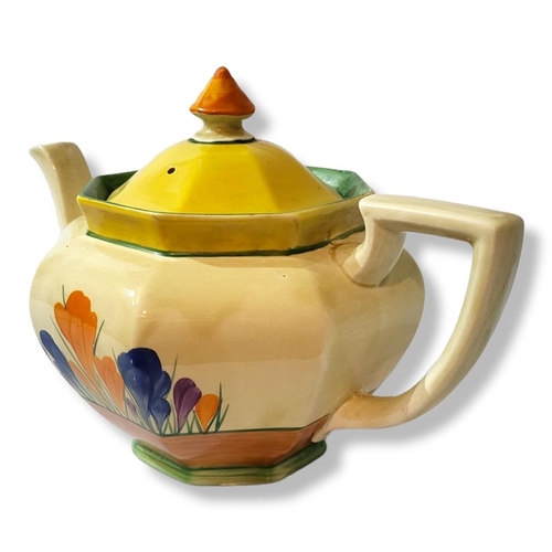 330 - CLARICE CLIFF, CROCUS RANGE, AN ART DECO OCTAGONAL TEAPOT
Marked to base 'Crocus, Bizarre, Wilkinson... 