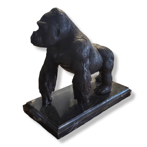 345 - A BRONZE AND MARBLE STANDING GORILLA STATUE
With textured decoration, on a stepped marble base.
(app... 