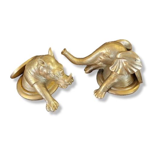 369 - A PAIR OF GILT BRONZE NOVELTY ELEPHANT AND RHINO TOP DESK PAPERWEIGHTS.
(h 9.5cm)
 
Condition: good