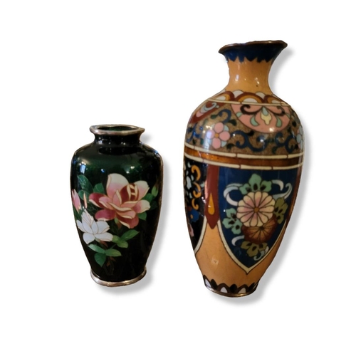 375 - A 20TH CENTURY JAPANESE CLOISONNÉ BOTTLE FORM VASE
Worked in copper wire, decorated with panels of s... 