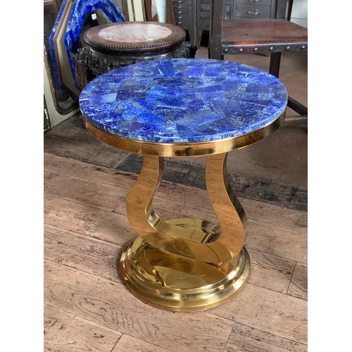 131 - A PAIR OF LAPIS LAZULI SIDE TABLES
On bronze steel bases.
(h 56.5cm x w 50.5cm x d 50.5cm)