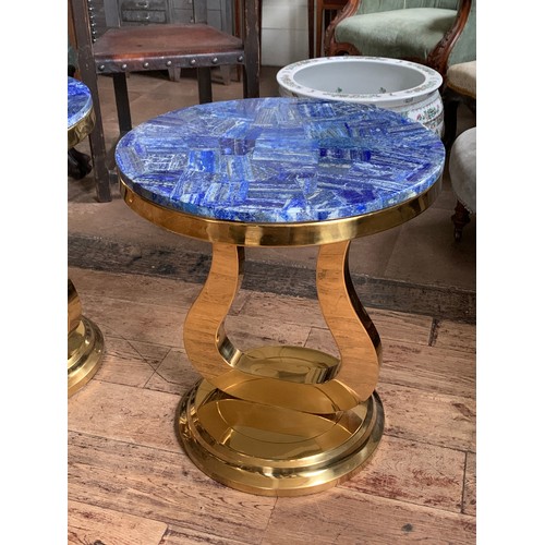 131 - A PAIR OF LAPIS LAZULI SIDE TABLES
On bronze steel bases.
(h 56.5cm x w 50.5cm x d 50.5cm)