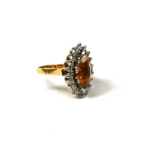 200A - AN 18CT YELLOW AND WHITE GOLD, CITRINE AND DIAMOND CLUSTER RING 
Having central marquise cut citrine... 