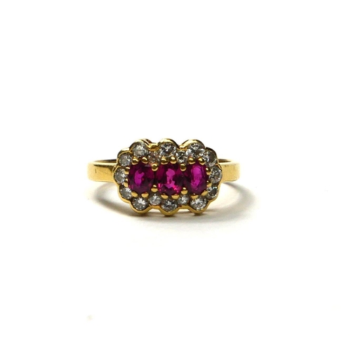 201A - AN 18CT GOLD, RUBY AND DIAMOND RING
Having three oval cut rubies surrounded by a halo of round cut d... 