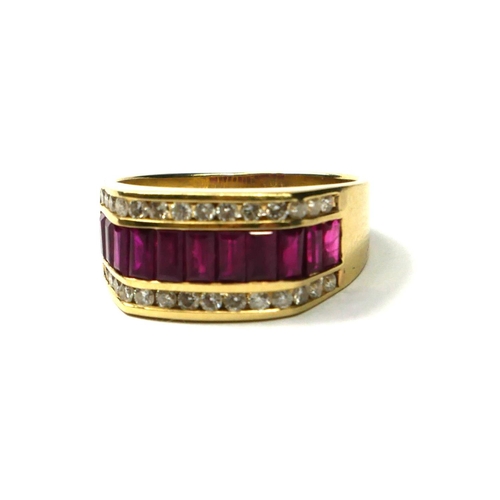 202A - A LARGE 14CT GOLD, RUBY AND DIAMOND RING
Having eleven baguette cut rubies flanked by two rows of di... 