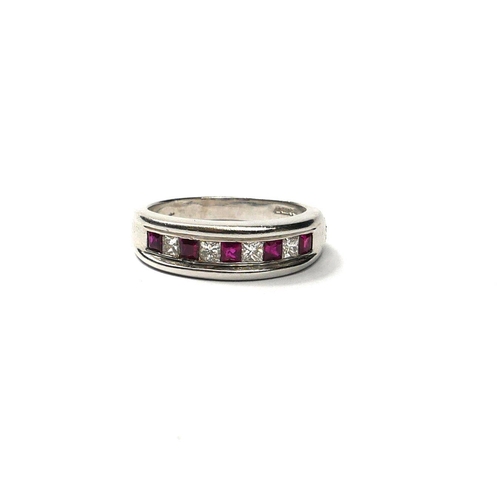 205A - AN 18CT WHITE GOLD, RUBY AND DIAMOND RING 
Having an alternating central square cut diamond and rubi... 