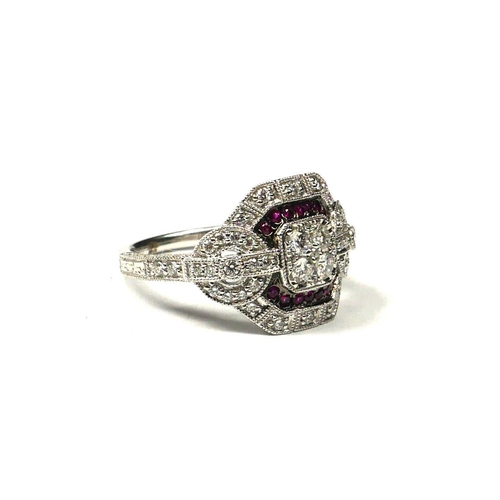 208A - AN ART DECO STYLE 18CT WHITE GOLD, RUBY AND DIAMOND CLUSTER RING
Having four central diamonds and tw... 