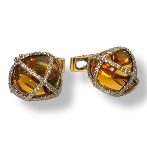 229A - A PAIR OF 18CT GOLD, DIAMOND AND AMBER GENT’S DOMED CUFFLINKS
Amber set with pavé diamonds. (approx ... 