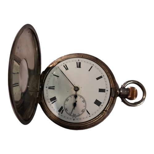 297 - AN EARLY 20th CENTURY CONTINENTAL  SILVER HALF HUNTER GENTS POCKET WATCH,having a black enanel numbe... 