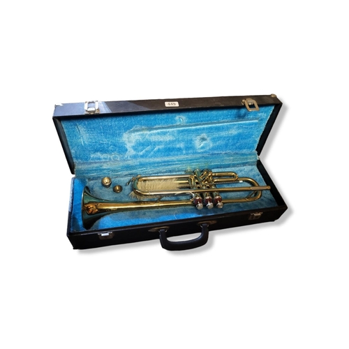 A B&M CHAMPION BRASS TRUMPET With two mouthpieces, in hard carry