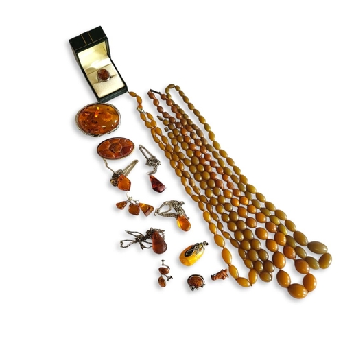 25 - A COLLECTION OF AMBER AND FAUX AMBER JEWELLERY
To include silver and cabochon cut amber brooch and r... 