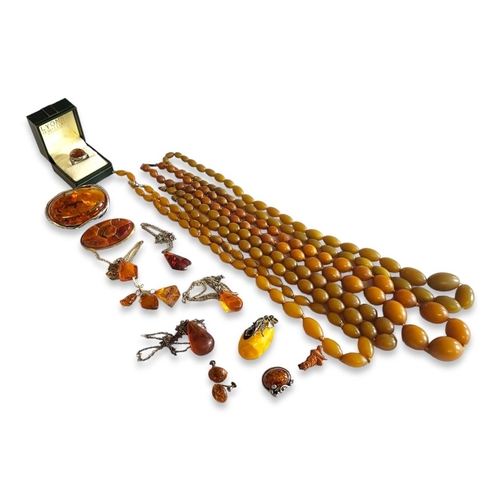 25 - A COLLECTION OF AMBER AND FAUX AMBER JEWELLERY
To include silver and cabochon cut amber brooch and r... 