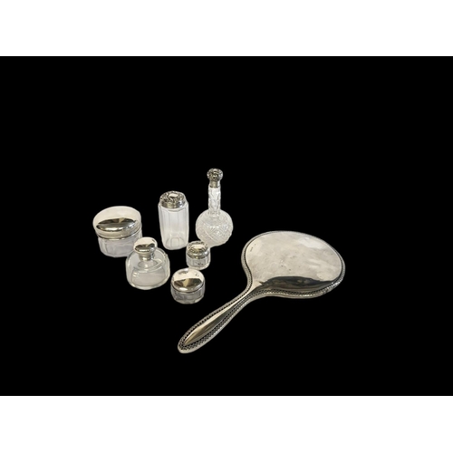 33 - AN EDWARDIAN CRYSTAL GLASS HALLMARKED SILVER MOUNTED SCENT BOTTLE
AND MATCHING COSMETIC JAR
Both Lon... 