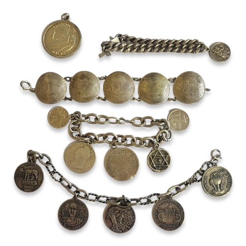 34 - A COLLECTION OF SILVER AND WHITE METAL COIN SET BRACELETS
To include a five Portuguese 10 Escudos co... 