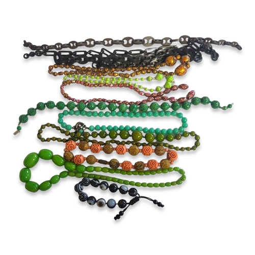 37 - A COLLECTION OF VINTAGE COSTUME NECKLACES
To include a coral and vegetable necklace and two hard sto... 