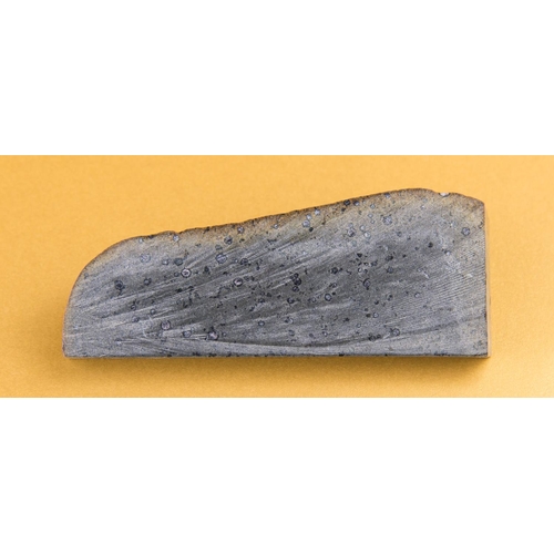 877 - CARBONACEOUS CHONDRITE METEORITE SLICE.
This slice was cut from a stone in Morocco, exposing the cho... 