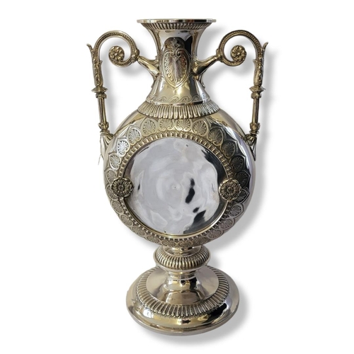 186A - AN AESTHETIC MOVEMENT AMPHORA SHAPED TWIN HANDLED SILVER PLATED VASE/CENTREPIECE 
Engraved on border... 