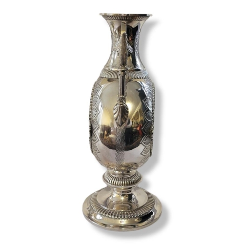 186A - AN AESTHETIC MOVEMENT AMPHORA SHAPED TWIN HANDLED SILVER PLATED VASE/CENTREPIECE 
Engraved on border... 