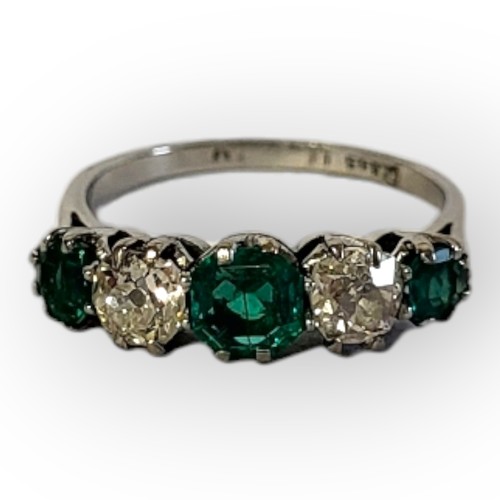 196A - AN EARLY 20TH CENTURY DIAMOND AND EMERALD FIVE STONE PLATINUM RING
Three round cut emeralds interspe... 