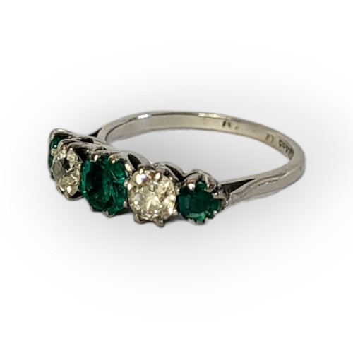 196A - AN EARLY 20TH CENTURY DIAMOND AND EMERALD FIVE STONE PLATINUM RING
Three round cut emeralds interspe... 