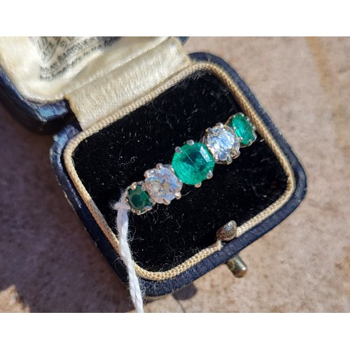 196A - AN EARLY 20TH CENTURY DIAMOND AND EMERALD FIVE STONE PLATINUM RING
Three round cut emeralds interspe... 