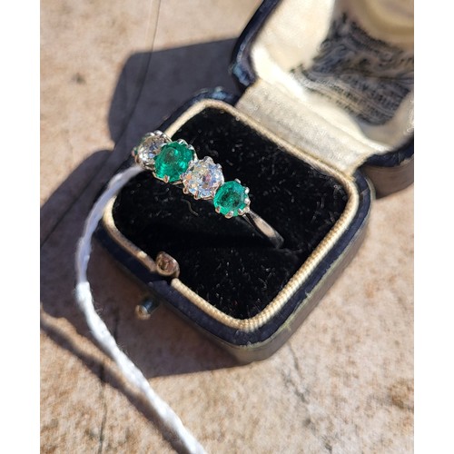 196A - AN EARLY 20TH CENTURY DIAMOND AND EMERALD FIVE STONE PLATINUM RING
Three round cut emeralds interspe... 